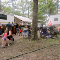 A family band picking' in the campground, with lots of family in attendence at the 2019 Armuchee Bluegrass Festival - photo by Audie Finnell
