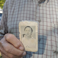Larry Smithed with his President's Ticket from an early festival with Carlton Haney's picture on the back at the 50th Anniversary Camp Springs festival - photo by Gary Hatley