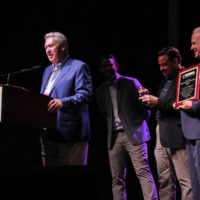 Allen Mills accepts his Distinguished Achievement Award at the 2019 IBMA Industry Awards - photo by Frank Baker