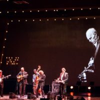 Sam Bush leads an all-star band in tribute to Bill Emerson at the 2019 IBMA Awards Show - photo © Tara Linhardt