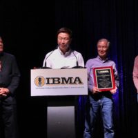 Pete Wernick, Hideyuki Watanabe, Toshio Watanabe, and Sam Bush at the 2019 IBMA Industry Awards - photo by Frank Baker