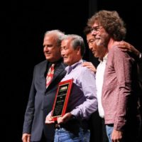 Pete Wernick, Toshio Watanabe, Hideyuki Watanabe, and Sam Bush at the 2019 IBMA Industry Awards - photo by Frank Baker