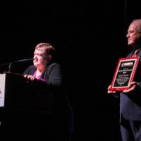 Katy Daley accepts her Distinguished Achievement Award at the 2019 IBMA Industry Awards - photo by Frank Baker