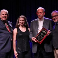 Pete Wernick, Francesca Huffman, Mickey Gamble, and Tim Surrett at the 2019 IBMA Industry Awards - photo by Frank Baker