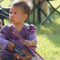 Littlest fiddler at the 2019 Oklahoma International Bluegrass Festival - photo © Pamm Tucker