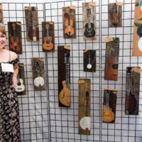 Katie Brobst and her musical artwork at Wide Open Bluegrass 2019 - photo © Tara Linhardt