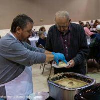Randy Barnes serves up biscuits for the IBMA Foundation breakfast at the Fall 2019 SOIMF - photo by Michael Gabbard
