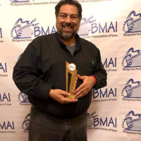 Greg Blake with his 2019 Male Vocalist of the Year award from the BMAI