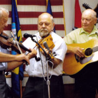 Bressler Brothers at the Summersville opry, 2008. L-R: Roger Williams, Clyde Williams, Andy Bressler (guitar), Alvin Bressler (bass). Roger’s younger brother Clyde, who now lives in North Carolina, was on the show on this occasion and fiddled the melody line to songs while Roger played harmony (“twin”). (Courtesy Roger Williams)