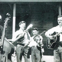 The D.N. Williams family band, ca. 1946. L-R: D.N. Williams (bass); D.N.’s sons (with Gibson A4 mandolin), Roger (violin), John (Gibson SJ guitar). All had the luxury of high-quality instruments. The mandolin and guitar were purchased by Joe with money saved during his World War II service. (Courtesy Roger Williams)