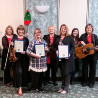Aynsley Porchak, Paula Breedlove, and Melanie Wilson out front as the newly inducted Daughters of Bluegrass at the 2019 Bluegrass Christmas in the Smokies
