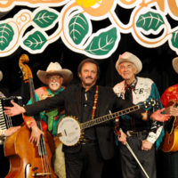 Host Michael Jonathon with Riders In The Sky at the 1,000th episode of the Woodsongs Old Time Radio Hour (11/19/19)