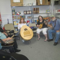 Taking advantage of the “practice room” before going on at the Snow Hill Bluegrass Jamboree - photo by Audie Finnell