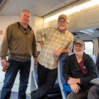 Dave Berry (seated) with Mark and Ted Kuster on the Amtrak to the Great 48 Jam - photo by Patrick Campbell