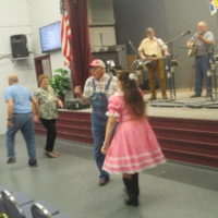 Dancing to a local group's tune at the Snow Hill Bluegrass Jamboree - photo by Audie Finnell