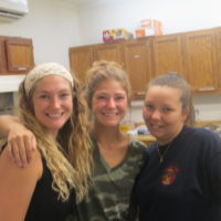 The kitchen help – all smiling volunteers eager to take your order at the Snow Hill Bluegrass Jamboree: Gracie Cochran, Bailey Doss, and Jessica Gunter - photo by Audie Finnell