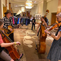 Young folks jam in the hallway at Wintergrass 2020 - photo by Mary Ann Goldstein