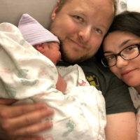 Kent, Rick, and Nicole Faris enjoy a quiet moment after Kent's birth on July 2, 2020