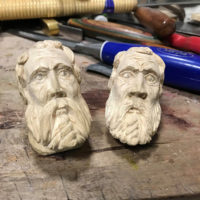 Pair of practice heads carved by Jason Barie before building his first fiddle