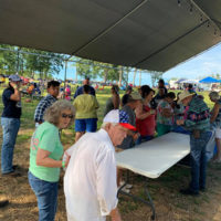 Fans at the record table at the 2020 Camp Springs Bluegrass Festival - photo by Melanie Wilson