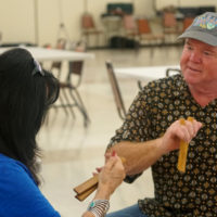 Jana Jae gets a lesson from Bones Patton at Fiddle Camp 2020 - photo © Pamm Tucker