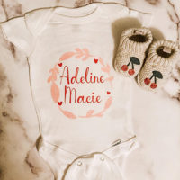 Adeline's first onesie, with matching booties