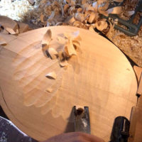 Gary Vessel shaping a mandolin back - photo by Dave Berry