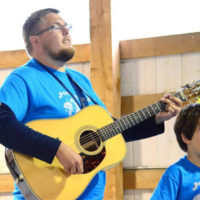 Aaron "Frosty" Foster leading the Kids Academy at the Jenny Brook Bluegrass Festival