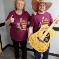 Lorraine Jordan with 2nd place winner Mike Neal and his autographed guitar