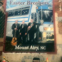 Nearly completed Easter Brothers mural in progress in Mount Airy, NC (April 2021)