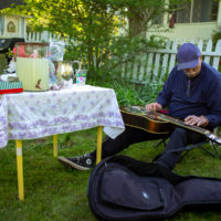 Pete Weichwein on reso-guitar at a house concert in Tacoma Park, MD (May 1, 2021) - photo by Jeromie Stephens