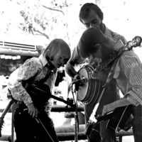A young Stuart Duncan and Alison Brown watch in amazement as John Hickman plays the banjo at Magic Mountain