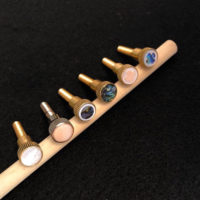 Inlaid resonator thumbscrews from Companion Custom Banjos
