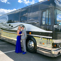 Zacrye Porter and Kaylee Moser getting prom pics by Junior's bus