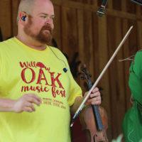Matt Hooper sports a vintage festival t-shirt at the 2021 Willow Oak Park Bluegrass Festival - photo by Laura Ridge