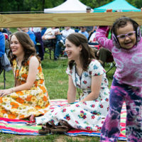 The Price Sisters enjoy the show with a young fan at DelFest Lite (Memorial Day weekend 2021) - photo © Tara Linhardt