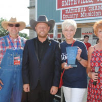 Jamie Dailey gets the Blue Blaze award at the 50th annual Smithville Fiddlers Jamboree, 2021
