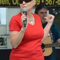 Terri Grannis is the MC for the Stump the Band contest at the 2021 Norwalk Music Festival - photo © Bill Warren