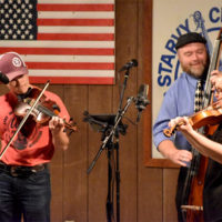 Trustin Baker sitting in with Michael Cleveland at the 2021 Starvy Creek Summer Bluegrass Festival - photo by Charlie Herbst