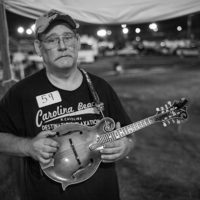 Mandolin competitor Opie Poindexter of Kernersville, NC in the tent at the Old Fiddlers Convention in Galax, VA (August 10, 2021) - photo by Jeromie Stephens
