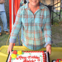 Kimberly Williams with her birthday cake at the 2021 Milan Bluegrass Festival - photo © Bill Warren