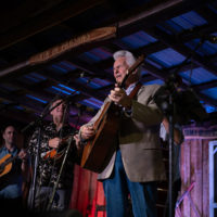 Del McCoury shares the stage with The Travelin' McCourys at the 2021 Pickin' in Parsons festival - photo by Jeromie Stephens