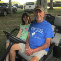 Founder Chuck Langley with Scarlett Webb, the granddaughter of one of his festival workers. Scarlett said she wanted to be a worker there someday, as well at the Labor Day 2021 Armuchee Bluegrass Festival