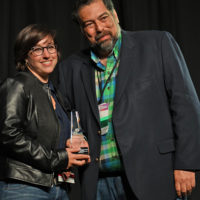 Anna Frick accepts her Sound Engineer of the Year award from Greg Blake at the 2021 IBMA Industry Awards - photo © Bill Reaves