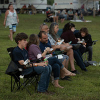 Family enjoying festival food and live bluegrass music, Camp Springs, North Carolina - photo by Jeromie Stephens