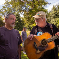 Ronnie Simplins talks with bandmate Dudley Connel during soundcheck. Mount Airy Farm, Warsaw, VA Saturday September 25th, 2021 - photo by Jeromie Stephens