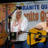 Penny and Steve Kilby receive plaque from Vivian Pennington Hopkins for their outstanding support for bluegrass and old time music at the 2021 Granite Quarry Fiddlers' Convention in Salisbury, NC - photo by Gary Hatley