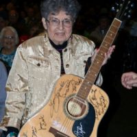 Winner of an autographed guitar at the 2021 Bluegrass Christmas in the Smokies - photo © Bill Warren