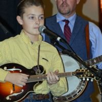 Carson Aldridge with Wood Family Tradition at the 2021 Bluegrass Christmas in the Smokies - photo © Bill Warren