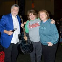 Another guitar winner at the 2021 Bluegrass Christmas in the Smokies - photo © Bill Warren